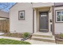 Close-up of the home's front entrance, highlighting the door and exterior details at 4425 S Lincoln St, Englewood, CO 80113