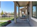 Inviting front porch with stately columns, providing an outdoor area to sit and relax at 3346 N Josephine St, Denver, CO 80205
