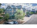 Attractive townhome featuring neutral siding, manicured landscaping, and convenient parking at 31112 Black Eagle Dr # 101, Evergreen, CO 80439