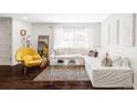 Bright living room featuring hardwood floors, a comfortable sectional, and modern decor at 221 Adams St, Denver, CO 80206