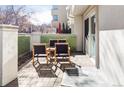 Relaxing outdoor patio featuring brick flooring, comfortable seating, and a semi-privacy screen at 221 Adams St, Denver, CO 80206