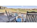 Inviting outdoor firepit area with comfortable seating, ideal for entertaining friends and Gathering in a tranquil setting at 15842 Willow St, Thornton, CO 80602