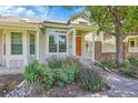 Charming home exterior with a landscaped front yard and a cozy entrance at 2972 W Long Dr # C, Littleton, CO 80120