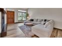 Cozy living room featuring a large window, fireplace and comfortable seating at 2972 W Long Dr # C, Littleton, CO 80120