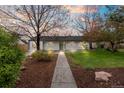 Charming home showcasing a well-maintained front yard, mature trees, and a walkway leading to the front door at 3222 S Fairfax St, Denver, CO 80222