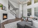Cozy living room with staircase, fireplace, and comfortable seating arrangement at 5399 Valentia St, Denver, CO 80238