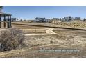 View of the surrounding homes and open space from a home site in the community at 9752 Canyon Wind Pt, Parker, CO 80138