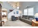 Inviting living room showcasing high ceilings, neutral tones, and comfortable seating arrangements at 10554 Tracewood Cir, Highlands Ranch, CO 80130