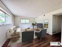 Bright living room featuring hardwood floors, two windows, and tastefully chosen furniture and decor at 50 E Highline Cir # 101, Centennial, CO 80122