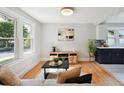 Inviting living room features hardwood floors and abundant natural light at 3226 Grant St, Englewood, CO 80113