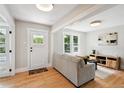 Bright living room with hardwood floors and neutral, modern furniture at 3226 Grant St, Englewood, CO 80113