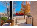 View from front steps showing a quiet street and autumn leaves at 427 S Quay St, Lakewood, CO 80226