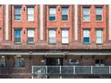 Close up of the building entrance of Palladium Lofts showcasing its brick facade at 2261 Blake St # 2G, Denver, CO 80205