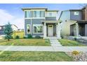 This inviting two-story residence boasts a modern design, a manicured lawn, and a charming front entrance at 2754 W 69Th Ave, Denver, CO 80221