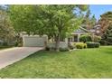 Charming single-Gathering home with mature shade tree and well-maintained lawn at 1894 S Marshall Cir, Lakewood, CO 80232
