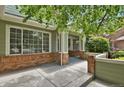 Inviting front porch with brick accents offering a welcoming entrance to the home at 1894 S Marshall Cir, Lakewood, CO 80232