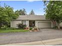 Attractive home with an attached garage, tidy landscaping, and a welcoming entryway at 13781 E Marina Dr # A, Aurora, CO 80014