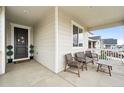 Inviting front porch with seating, perfect for relaxing and enjoying the neighborhood views at 1101 E Witherspoon Dr, Elizabeth, CO 80107