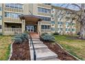 Apartment building at 350 S Clinton St, featuring a well-maintained lawn and manicured landscaping at 350 S Clinton St # 9C, Denver, CO 80247