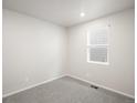 Bright bedroom with modern carpet and neutral colored walls at 1947 S Coolidge Way, Aurora, CO 80018