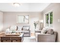 Bright living room showcasing hardwood floors, stylish decor, and ample natural light at 2255 Perry St, Denver, CO 80212