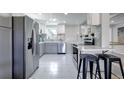 Modern kitchen with stainless steel appliances and white cabinets at 4720 E Mexico Ave, Denver, CO 80222