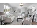 Bright living room featuring a comfortable sofa and large windows at 4720 E Mexico Ave, Denver, CO 80222