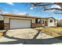 Traditional single-Gathering home, with a large driveway and two-car garage at 227 Olympus Cir, Lone Tree, CO 80124