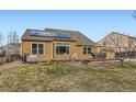 Expansive backyard featuring a well-maintained lawn, mature trees and a small deck at 884 W 124Th Dr, Denver, CO 80234