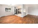 Inviting living space with hardwood floors adjacent to an updated kitchen with stylish cabinets at 1244 S Wright St, Lakewood, CO 80228