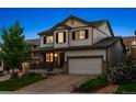 Charming two-story home with a well-manicured lawn and inviting front porch at 13822 Worthington Pl, Parker, CO 80134