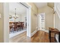 View from the hallway reveals an elegant dining area and an adjacent bathroom at 263 N Logan St, Denver, CO 80203
