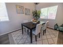 The Dining area includes a dark wood table, four chairs and decorative art at 5630 W 115Th Ave, Westminster, CO 80020