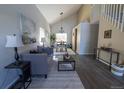 A spacious living room, featuring a comfortable gray sofa and modern decor at 5630 W 115Th Ave, Westminster, CO 80020