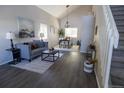 Bright and airy living room with hardwood floors, vaulted ceilings, and modern furniture at 5630 W 115Th Ave, Westminster, CO 80020