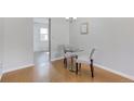 Cozy dining area with modern table, chairs, and stylish light fixture at 1482 S Pierson St # 75, Lakewood, CO 80232