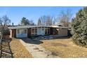Exterior of brick home with nice yard at 8280 E 104Th Way, Henderson, CO 80640