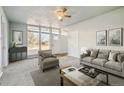 Bright living room featuring a neutral color palette, carpet flooring, and lots of natural light at 8280 E 104Th Way, Henderson, CO 80640