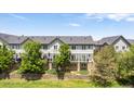 Charming townhouse with private balconies overlooking lush landscaping and green spaces at 2945 W Riverwalk Cir # B, Littleton, CO 80123