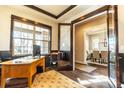 Cozy home office with natural light, a wooden desk, and sophisticated trim work at 1152 S Ogden St, Denver, CO 80210
