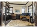 Inviting office space with custom built-in shelving and dark wood trim and accents at 1152 S Ogden St, Denver, CO 80210