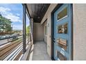 Modern entryway with blue front door, sleek design, and exterior view at 1372 Lowell Blvd # 1, Denver, CO 80204