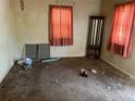 Living room with vintage decor, two windows, and natural light at 54 E Cornell Ave, Englewood, CO 80113