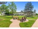 Relaxing common area featuring comfortable benches and well-maintained landscaping near the building at 9320 E Center Ave # 4B, Denver, CO 80247