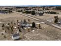 Aerial view of property featuring a lush backyard with deck and proximity to walking trails at 34942 Wagon Wheel Trl, Elizabeth, CO 80107