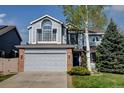 Charming two-story home with a well-maintained lawn, mature trees, and an attached two-car garage at 2937 W Yarrow Cir, Superior, CO 80027