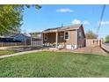 Quaint single-story home with a covered front porch and manicured lawn at 391 N 7Th Ave, Brighton, CO 80601