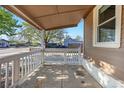 Covered front porch offers a welcoming space with ample room for seating at 391 N 7Th Ave, Brighton, CO 80601