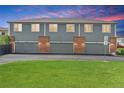 A row of townhome garages showcases convenient parking and well-maintained landscaping at 8237 W 54Th Ave # 2, Arvada, CO 80002