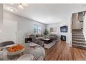 Inviting living room with modern fireplace, plush seating, and a beautiful dining area at 8237 W 54Th Ave # 2, Arvada, CO 80002